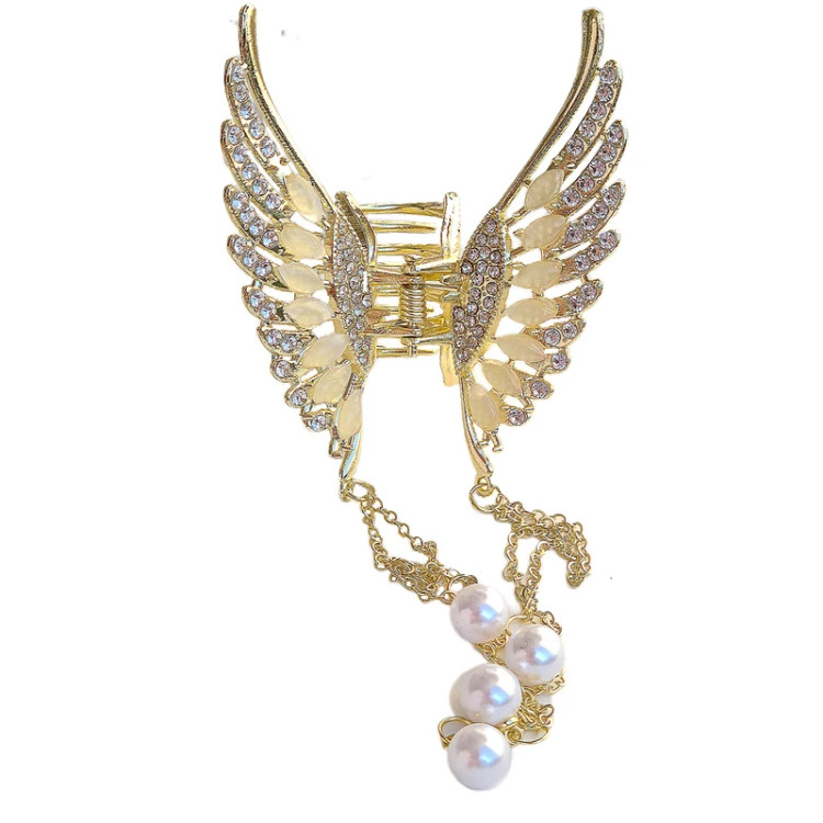 کلیپس مو زنانه مدل بال فرشته آویزدار نمای سفید