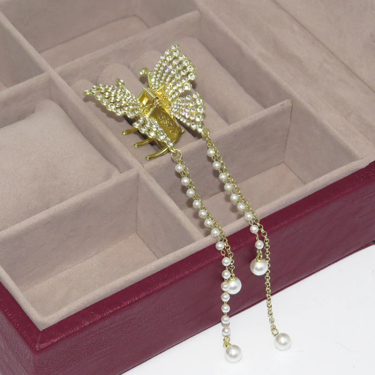 کلیپس مو زنانه مدل پروانه نگین دار نمای داخل جعبه