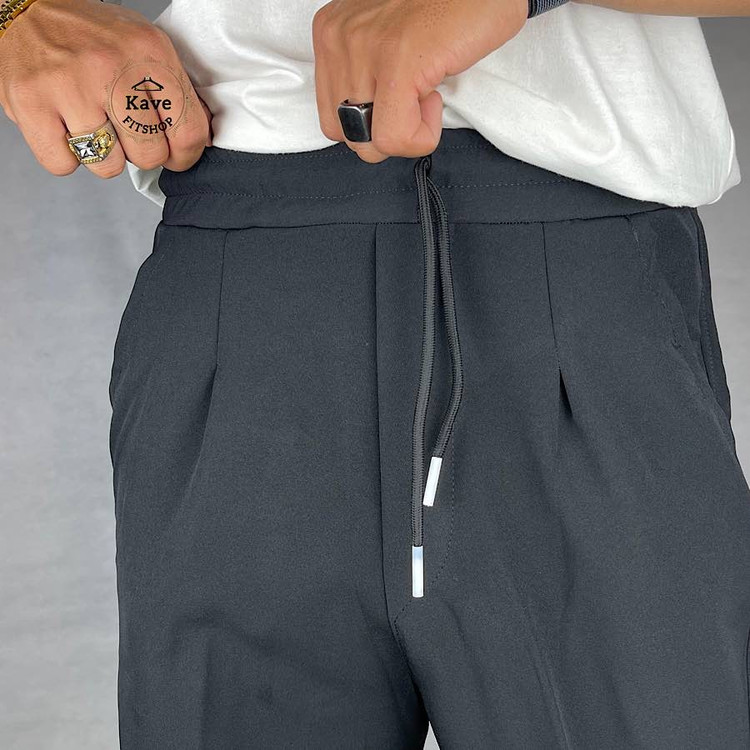 شلوار مردانه مدل بگ کلاسیک مازراتی رنگ مشکی نمای پارچه